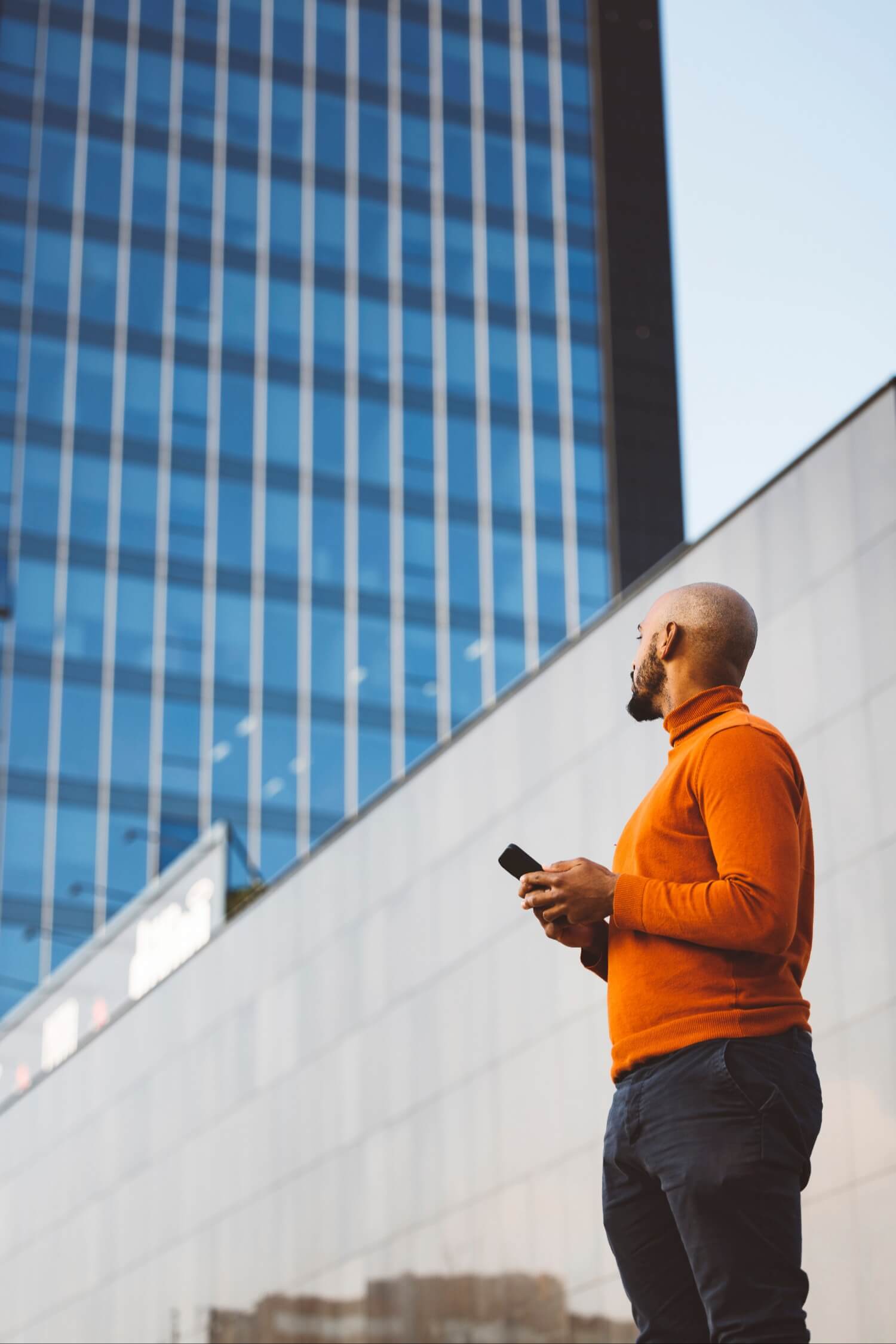 Man standing and smiling outside